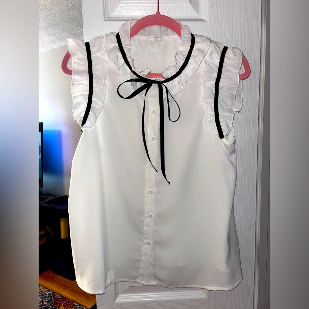 White Ruffled Sleeveless Top with Black Trim